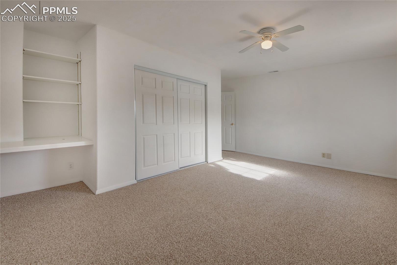 Bedroom 4 with built ins and closet