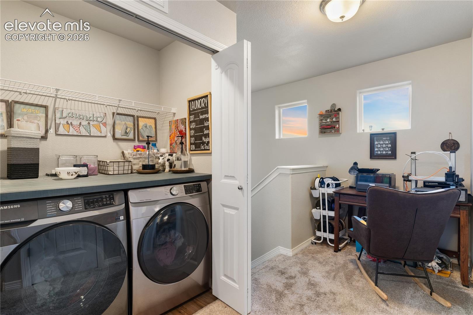 Dedicated laundry area with countertop space and overhead shelving, washer and dryer included 