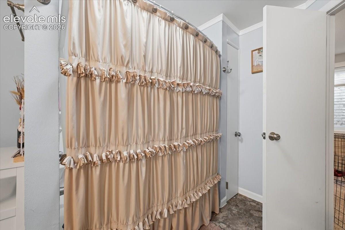 Additional storage with multiple towel rods and a linen closet.