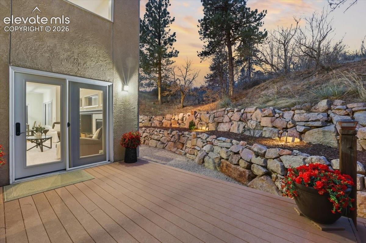 Spacious composite deck with stucco exterior