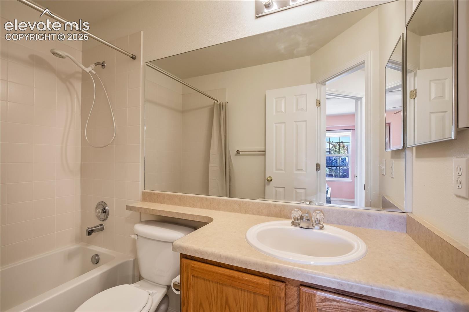 The additional upper-level full bath features a tub/shower combination, vanity storage + convenient access from the secondary bedrooms.