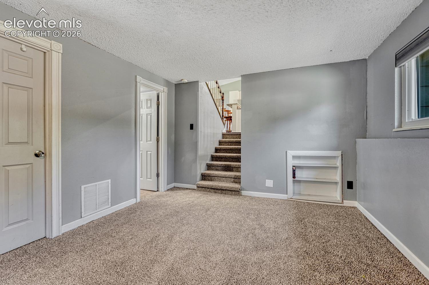 View to the main level from the lower level Living Room.