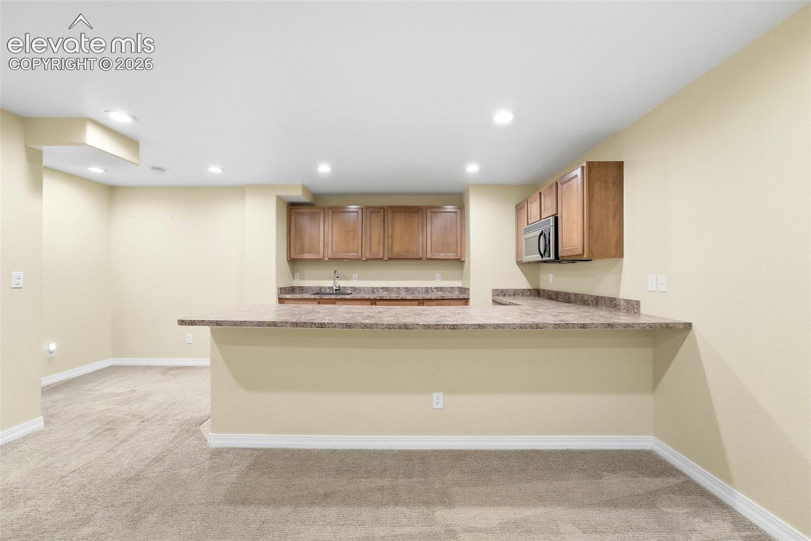 View of Large Counter Bar at Kitchenette