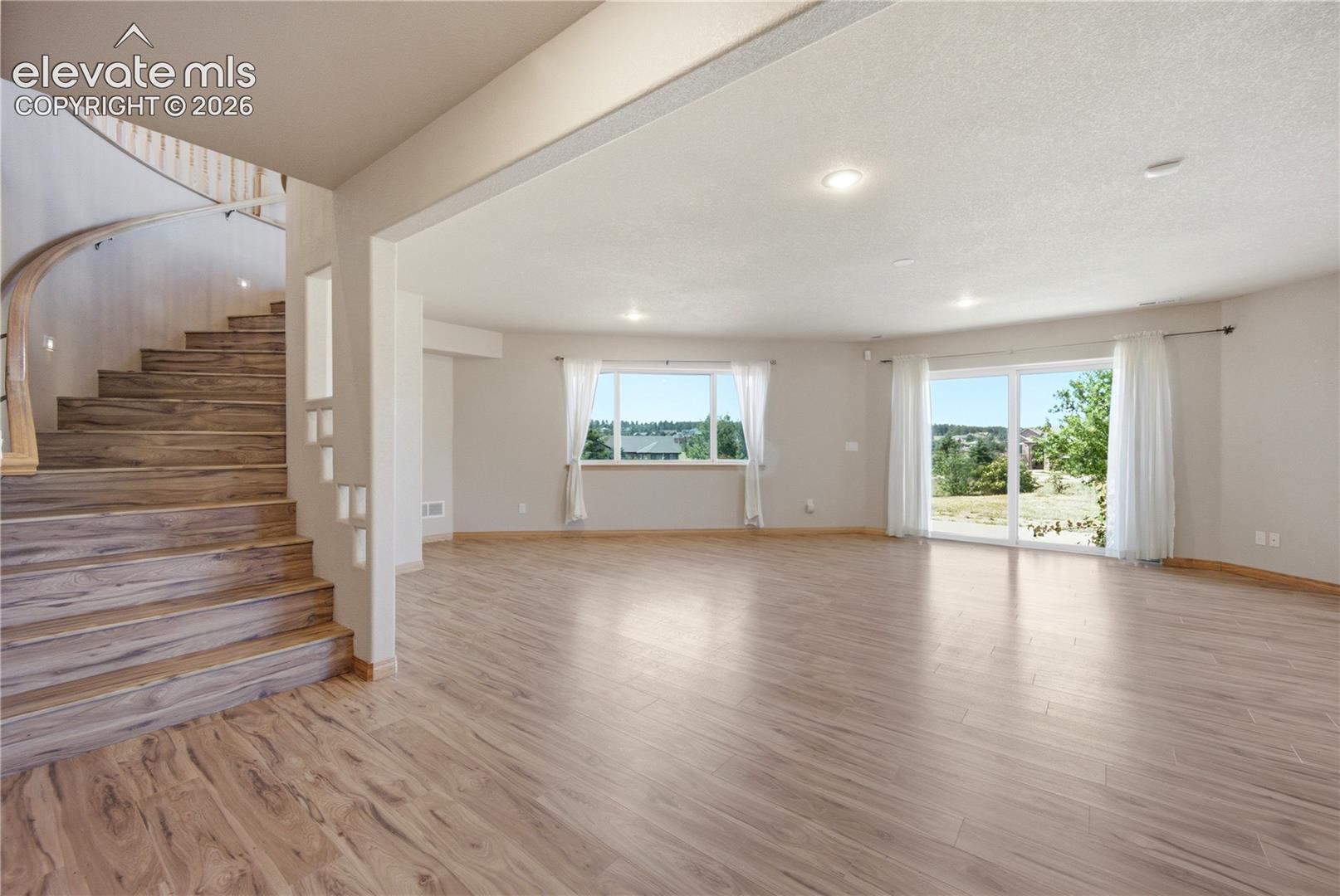 Game Room with walkout to patio. wet bar and adjacent theater room