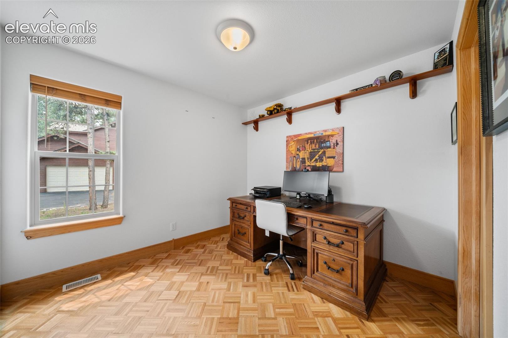Main level bedroom being utilized as an office