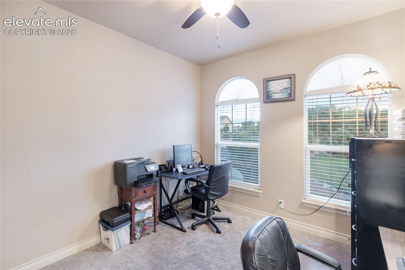 Main level secondary bedroom being used as a home office