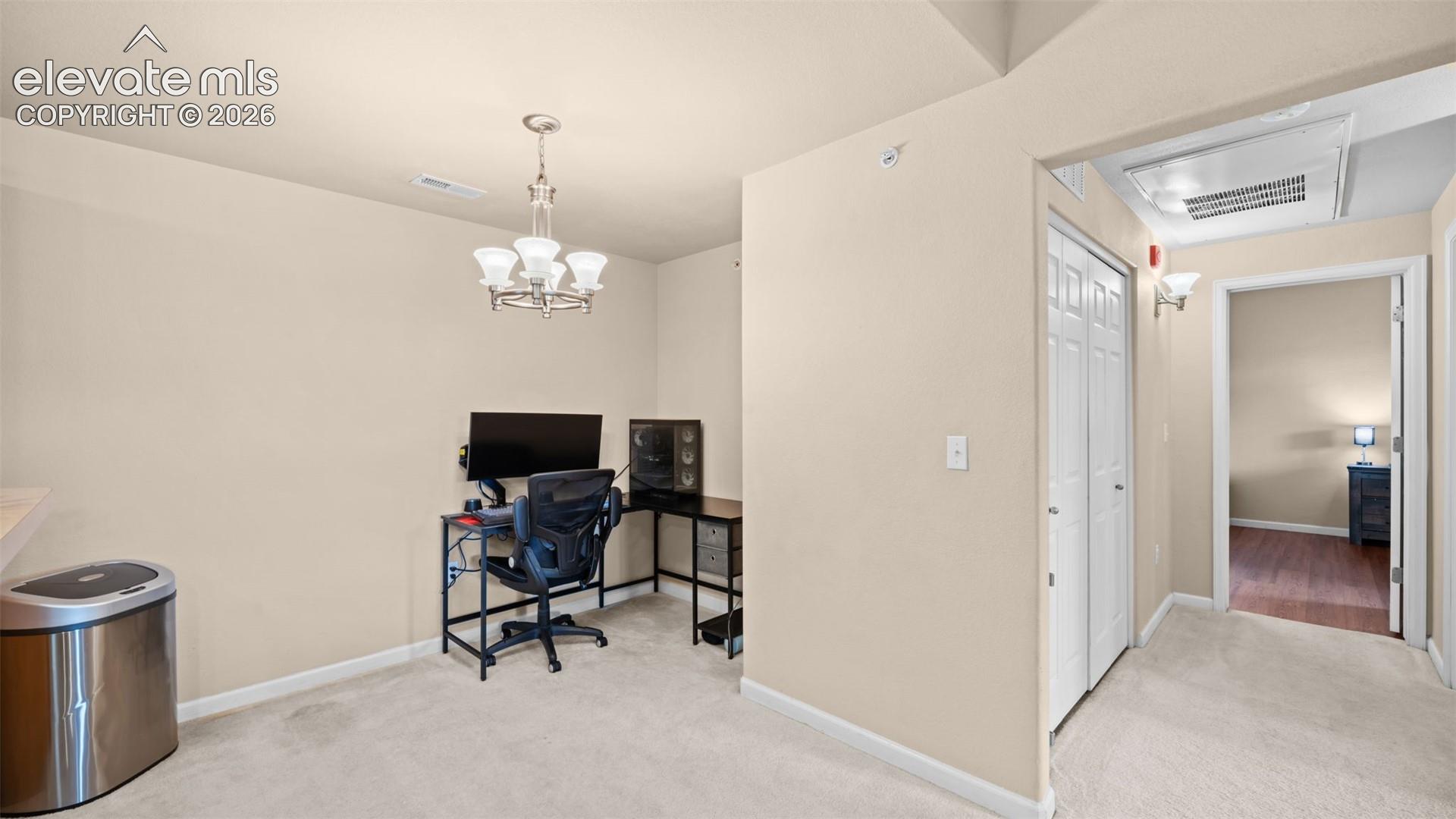 Neutral-toned walls complement light-colored carpeting