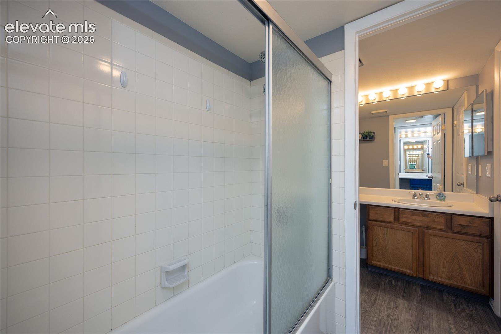 Shower/Tub is shared between Primary Bathroom and Guest Bathroom