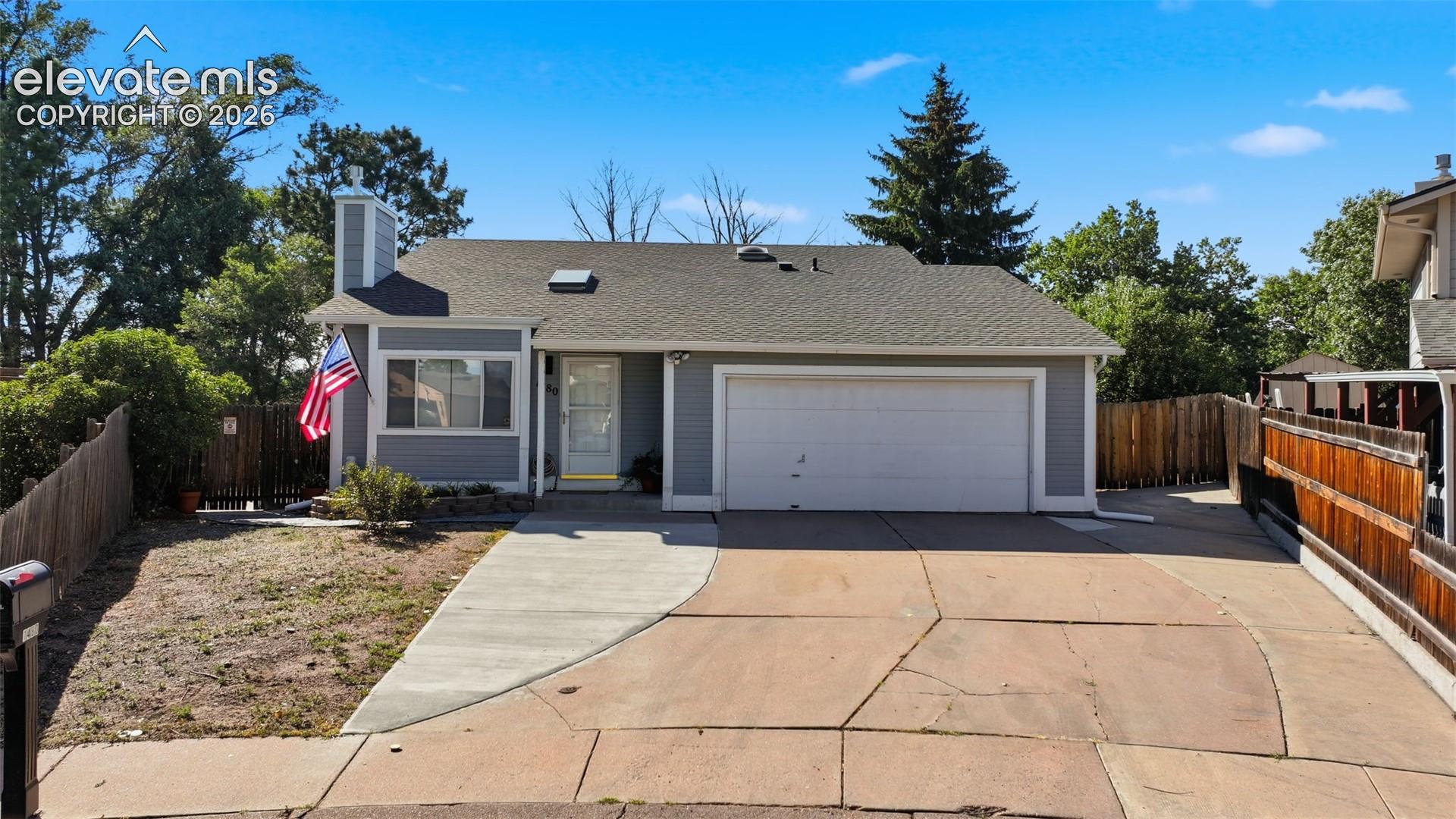 Space for RV or trailer parking on right side of garage and gate to back yard for more utility vehicle storage