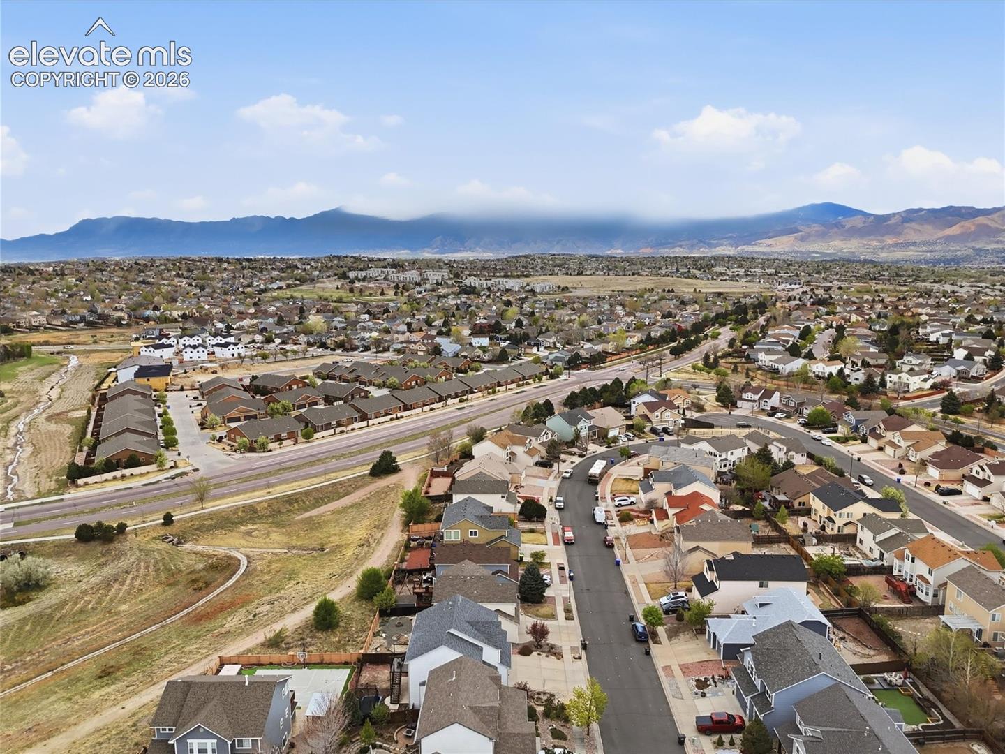 Expansive neighborhood setting with distant mountain scenery