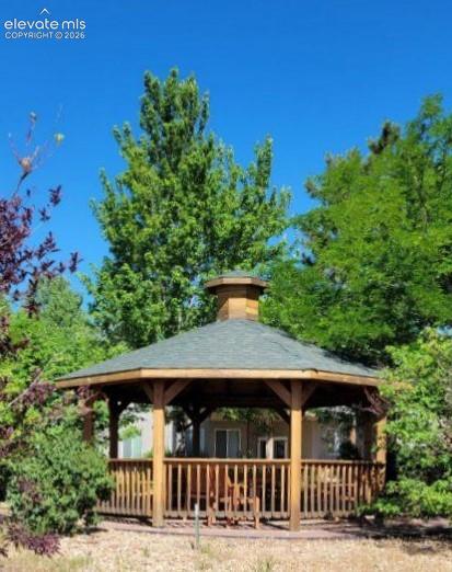 Gazebo during the summer months with full foliage on trees