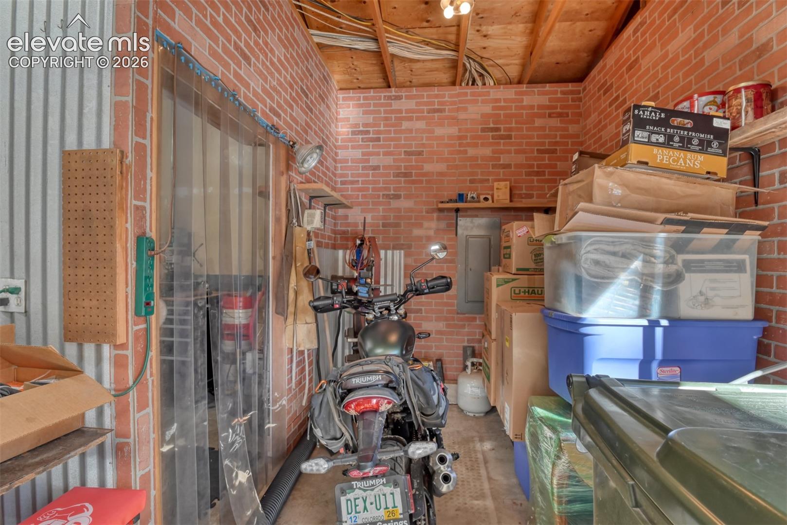 Space in garage to store motorcycle, bikes, trash barrels and more. 
