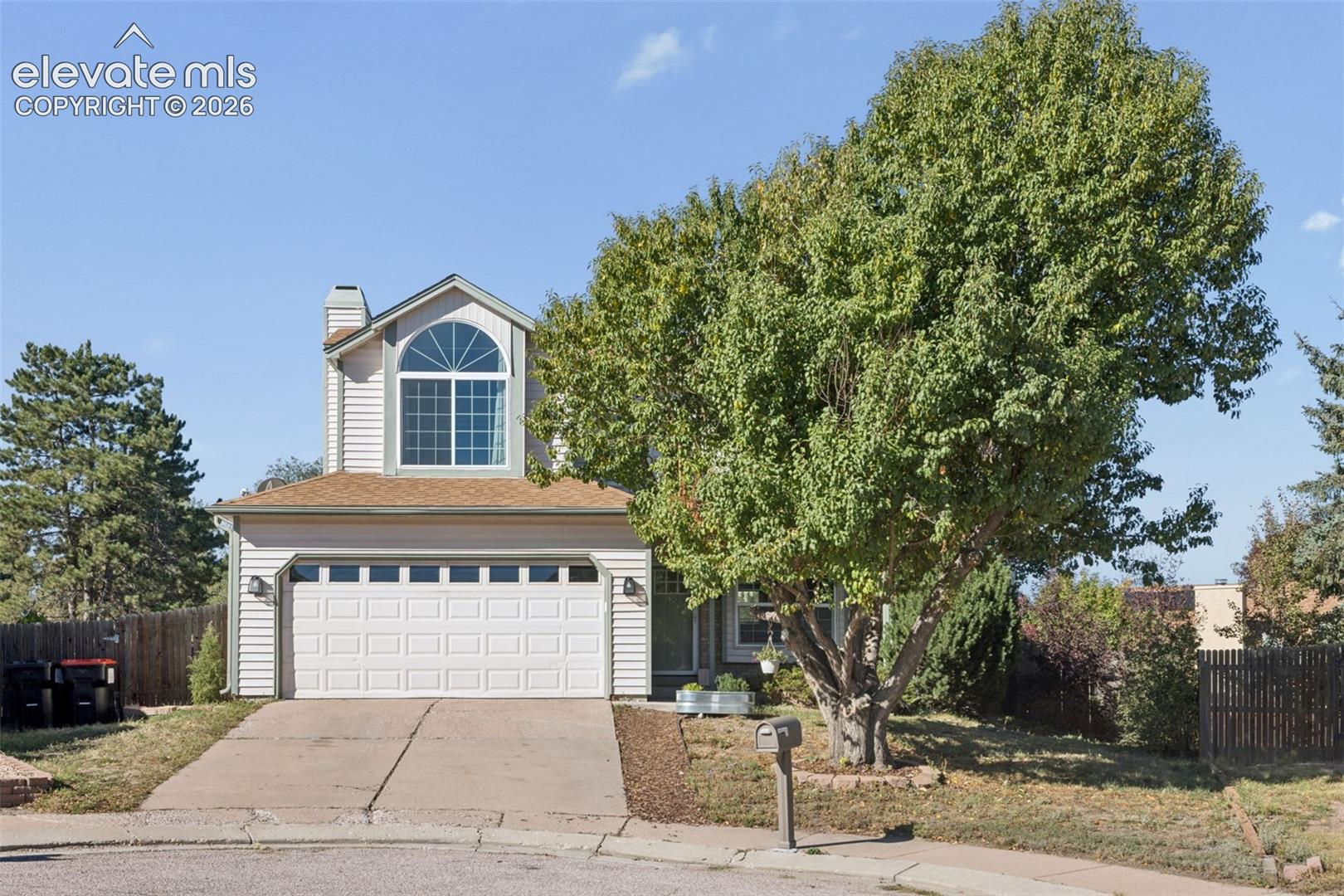 Two-story siding exterior with an integrated two-car garage