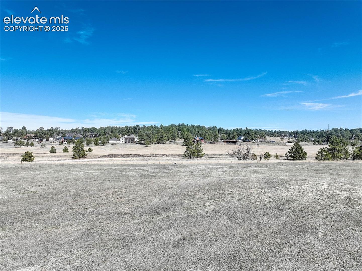 Overlooking Bayou Gulch facing North standing in the middle of the lot.