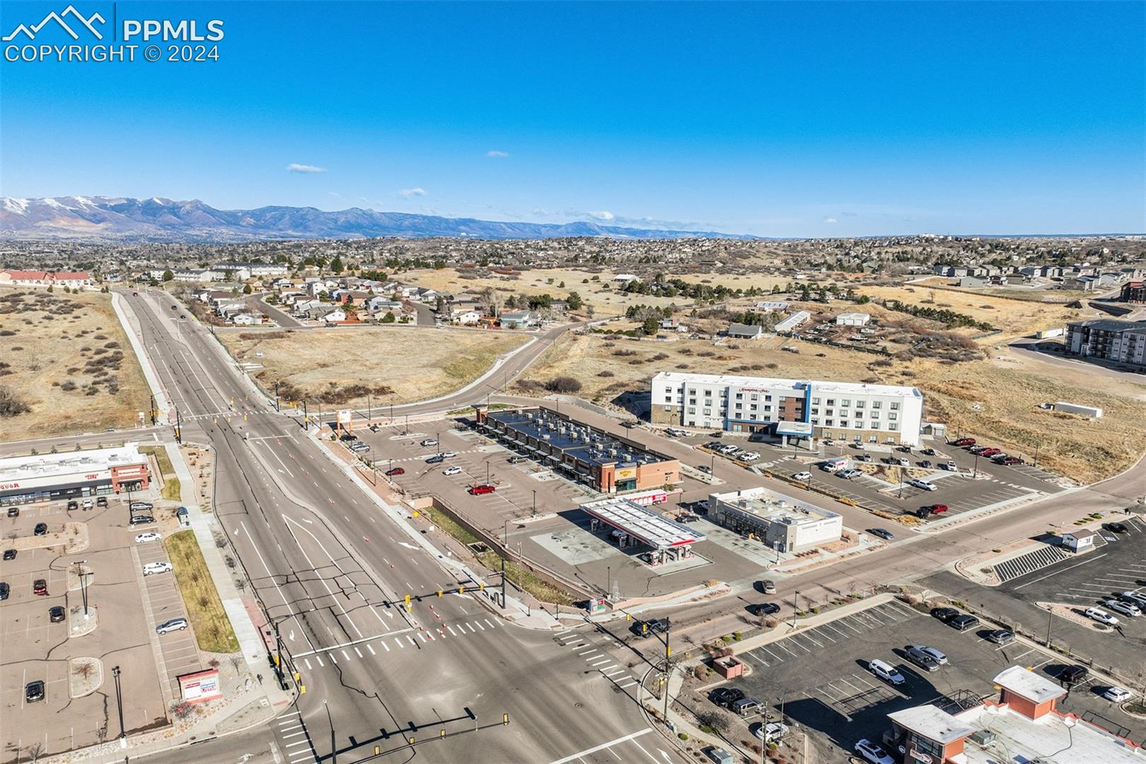 Birds eye view of property with a mountain view