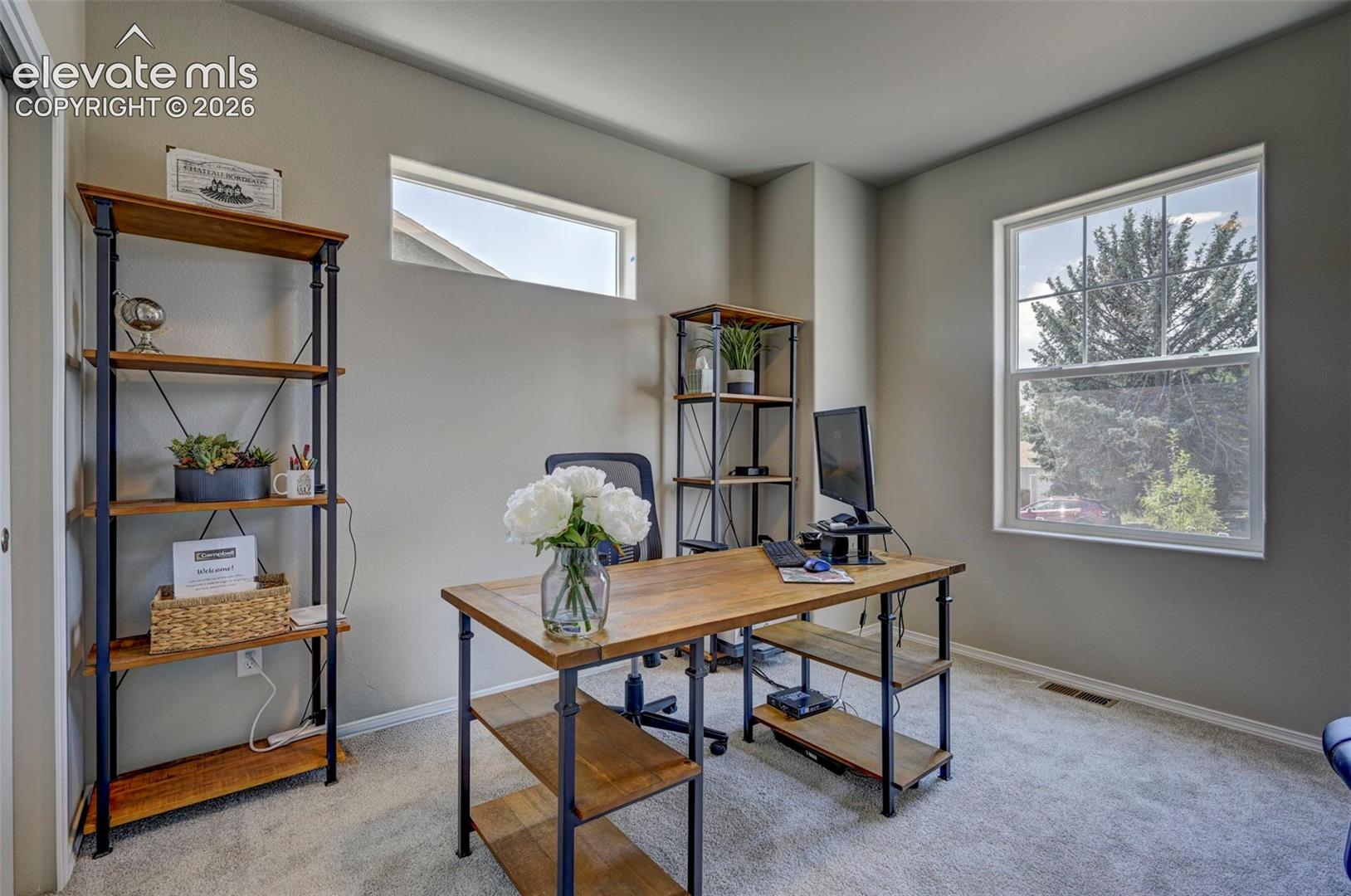 set up as office, but has closet doors for bedroom