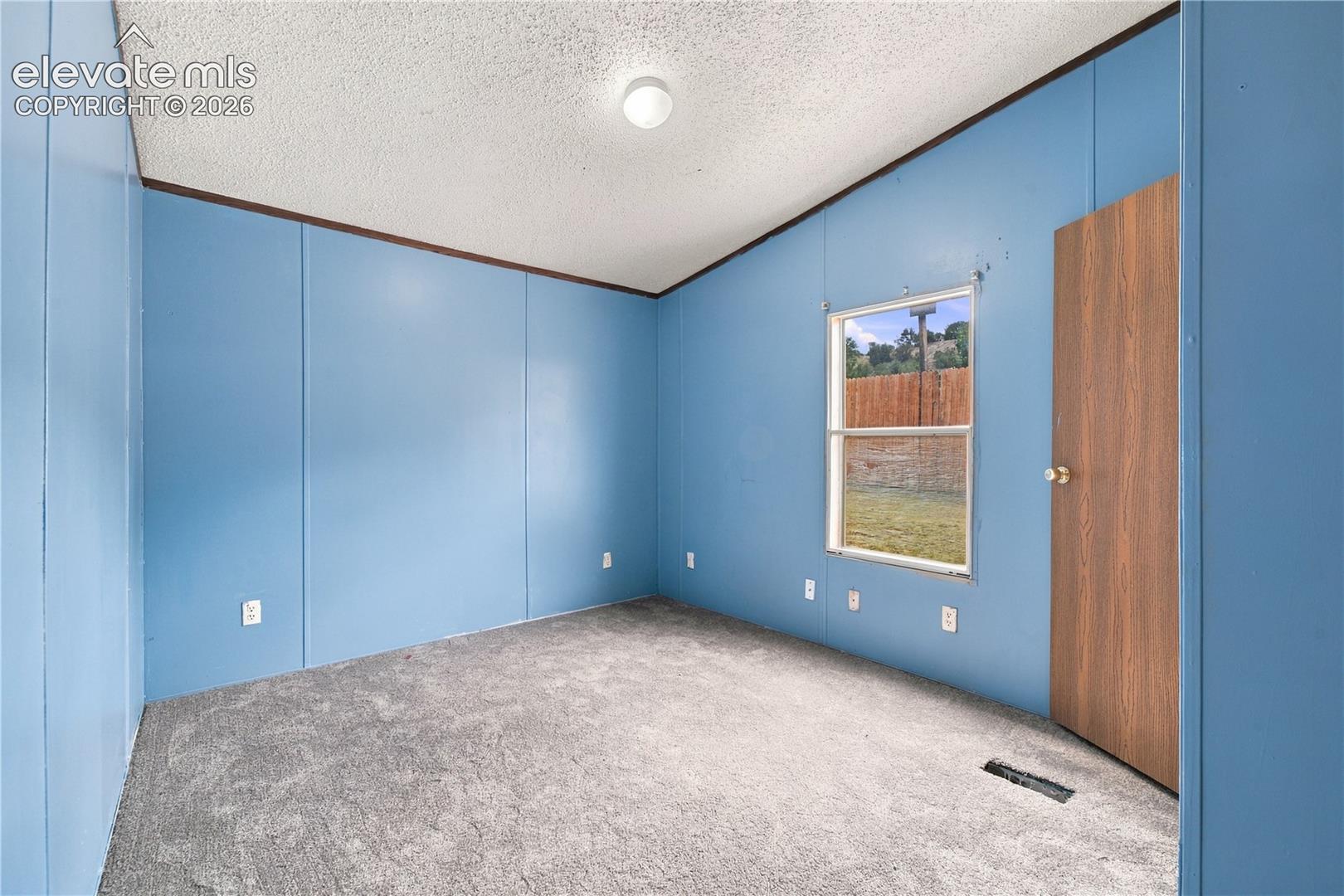 Textured ceiling with a flush-mount light fixture