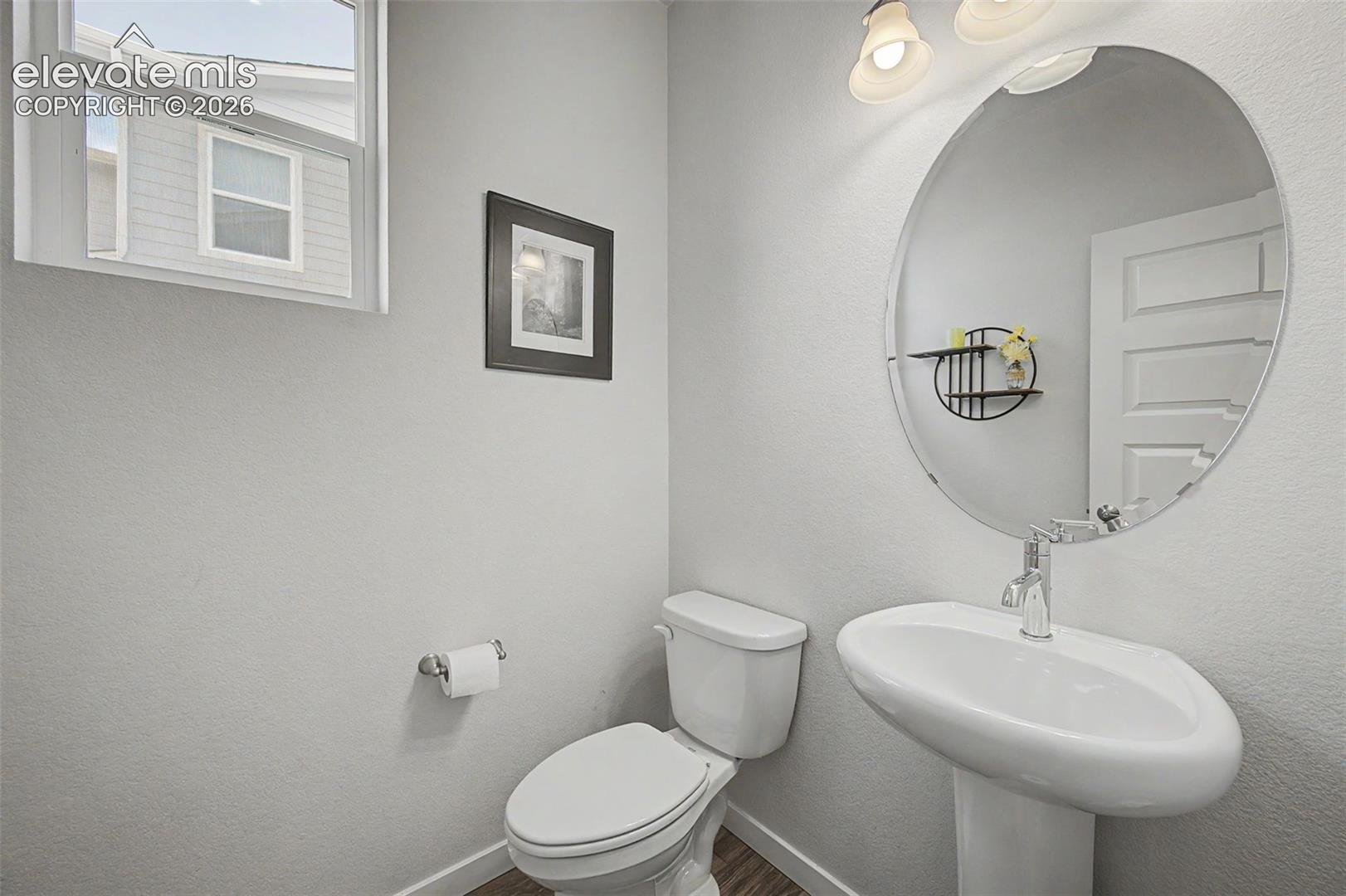 A convenient main floor powder room is accessible from the foyer.