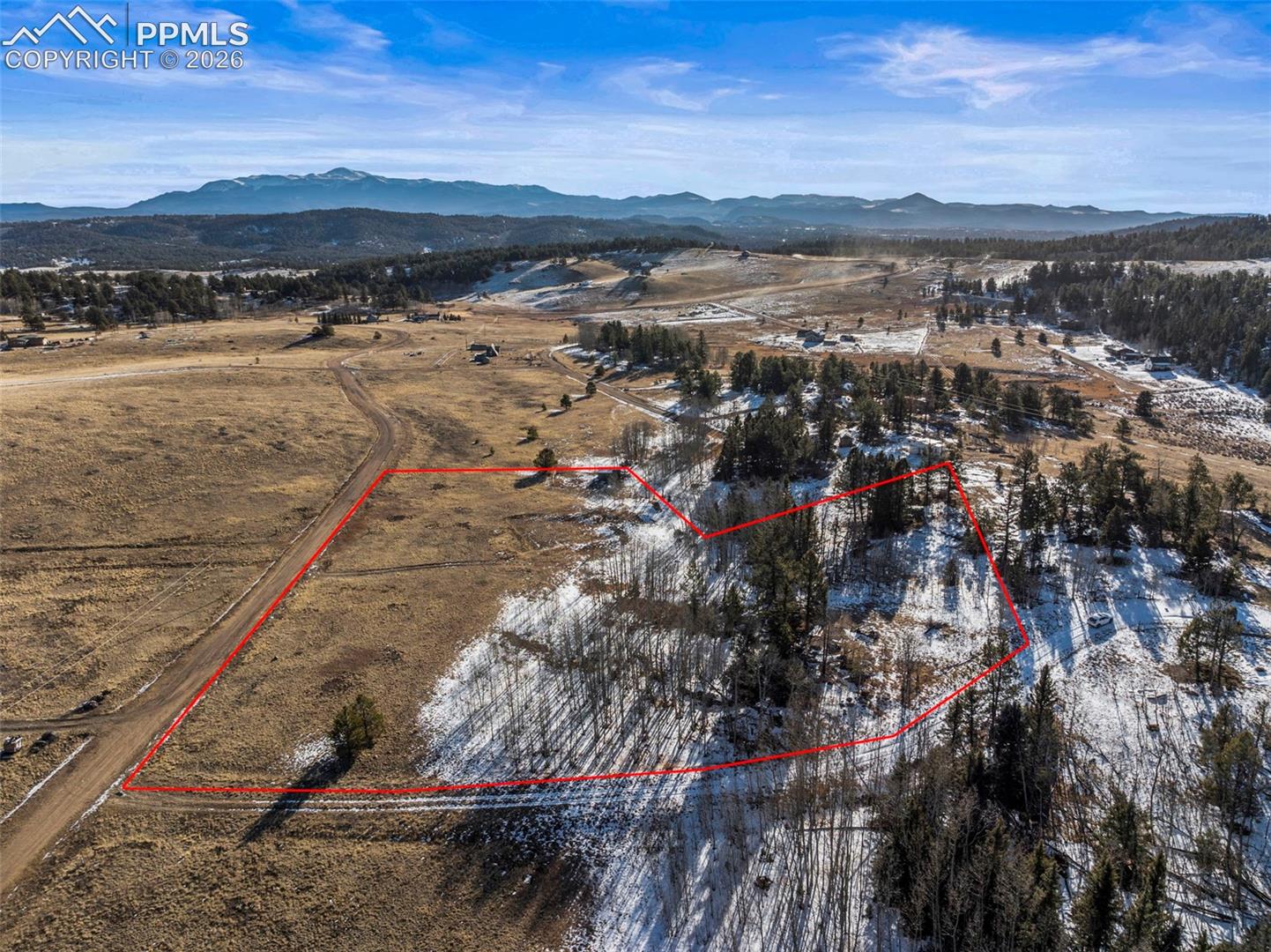 Overview of rural landscape with property parcel outlined and mountains. Property Lines are Approximate and not a survey.