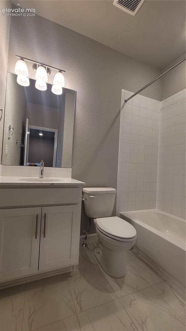 Full Bathroom with quartz countertop, tile surrounds, located on the upper level! 