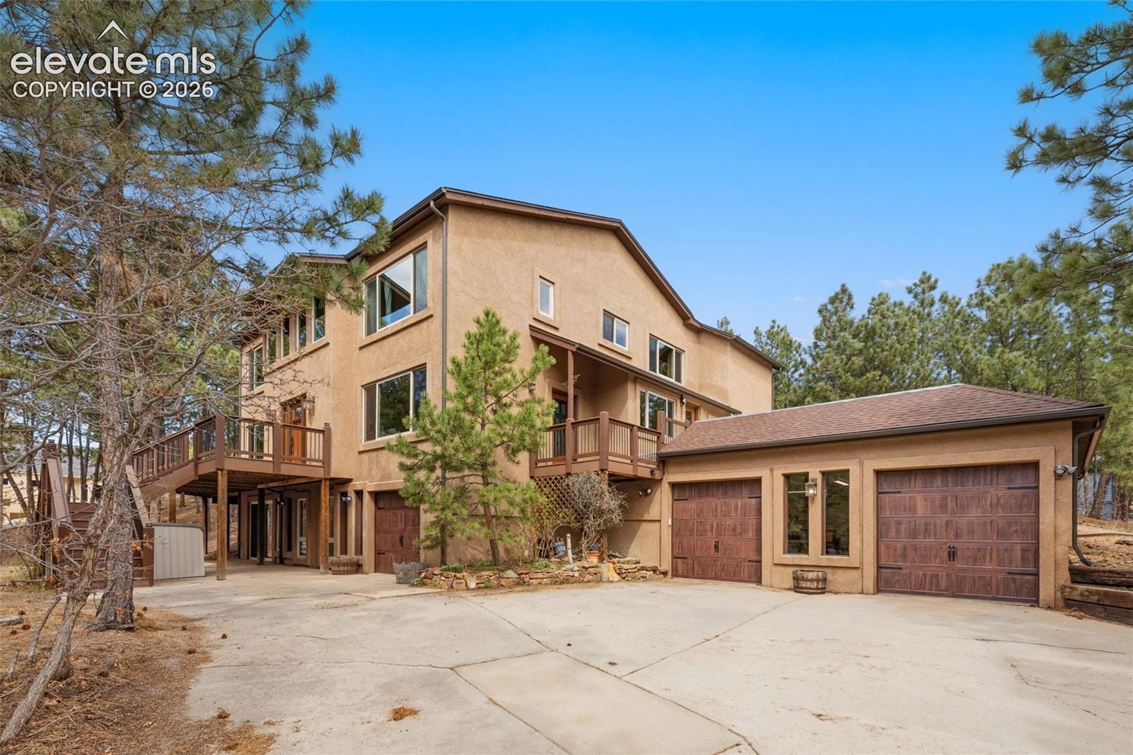 Front of property showing 3 car garage
