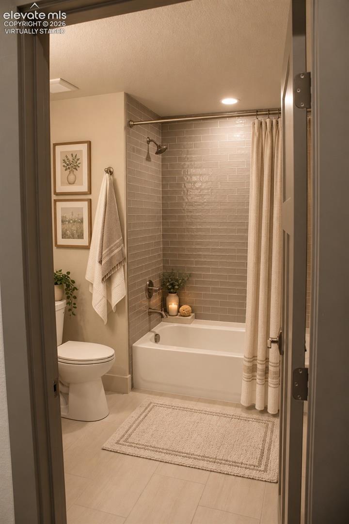 Virtually staged Subway tile shower surround with a fixed showerhead and tub, complemented by light-toned flooring