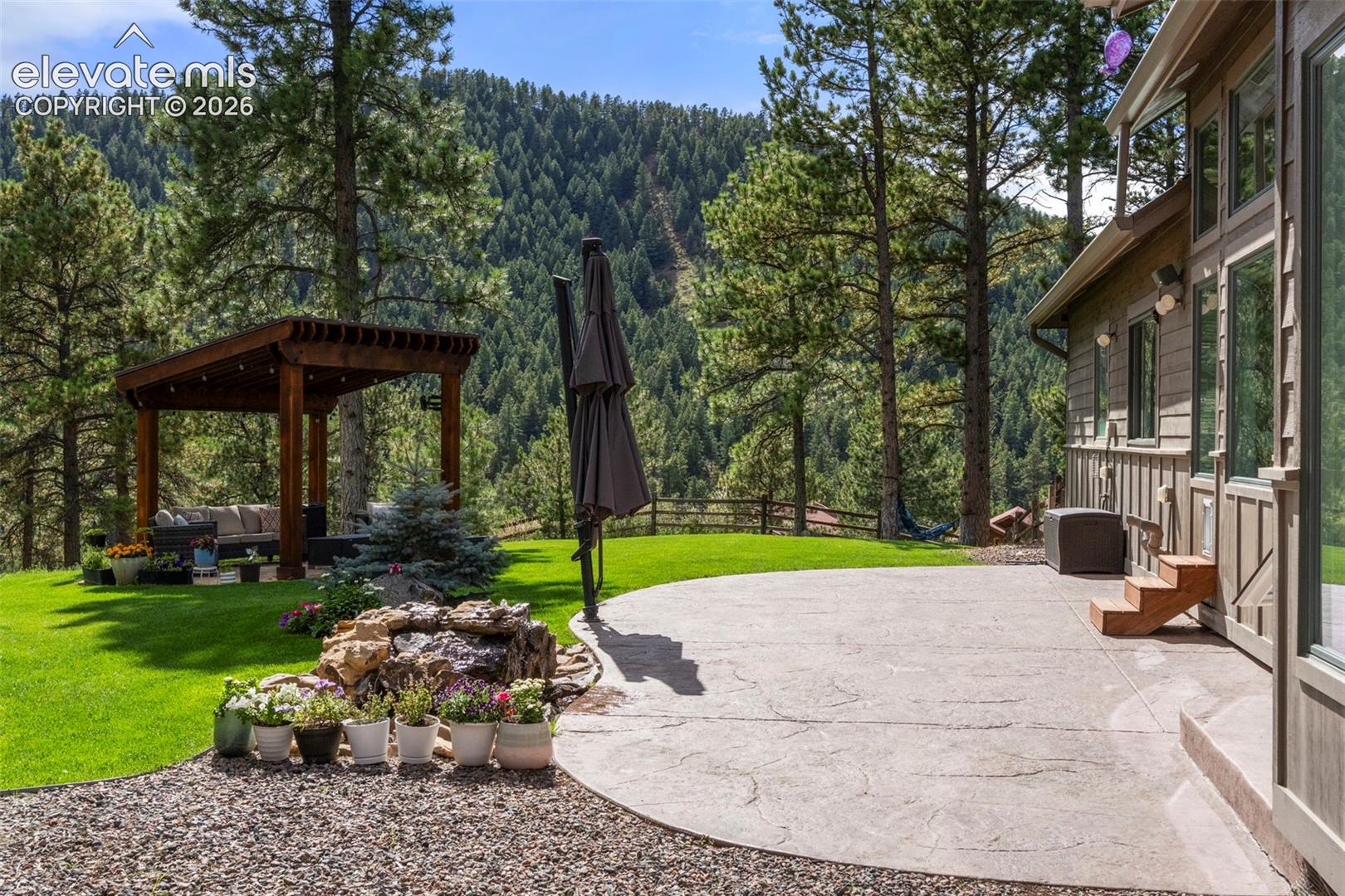 View of patio / terrace with a view of trees
