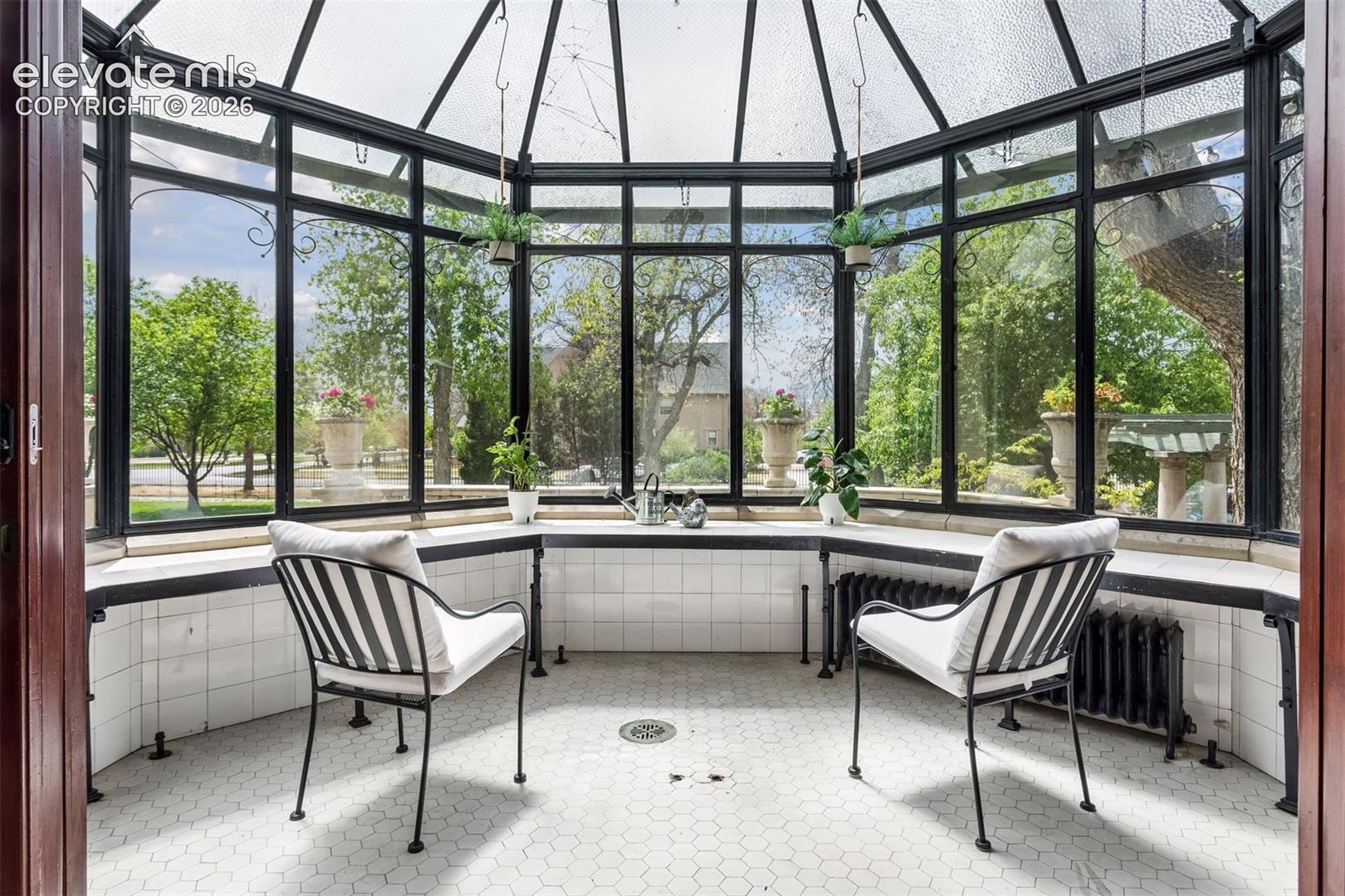 Conservatory built onto the northwest corner of the porch.
preserved greenhouse with original tile work is located off the formal dining room.