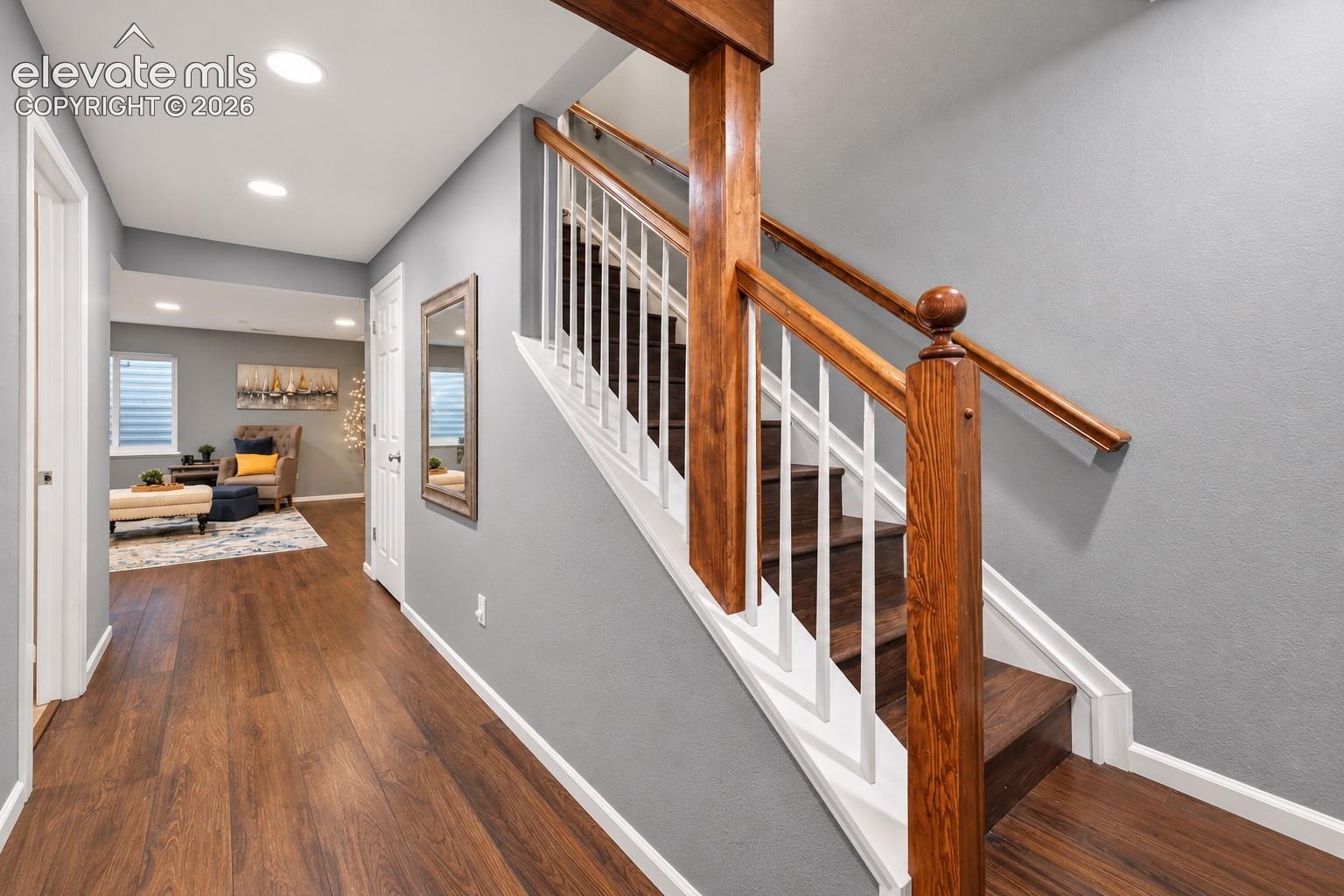 A cohesive palette and warm flooring carry naturally throughout the home.