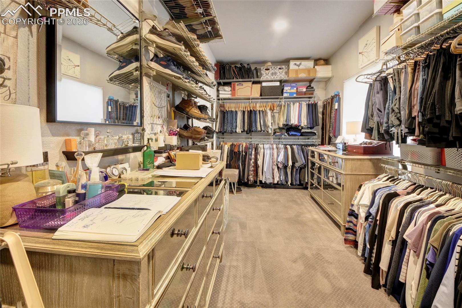 Master suite walk in closet that connects to the laundry room