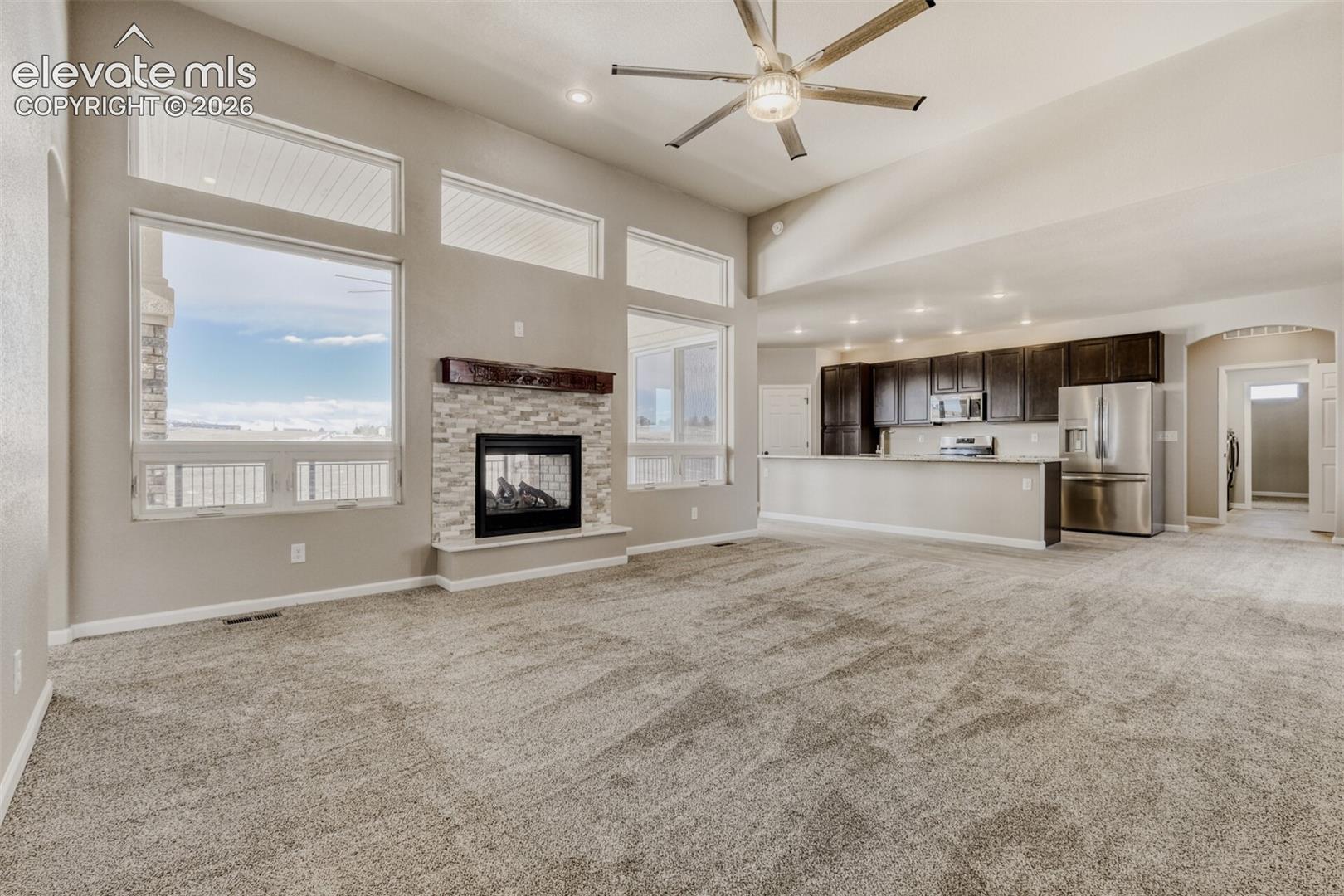 Living Room with open concept and covered deck.