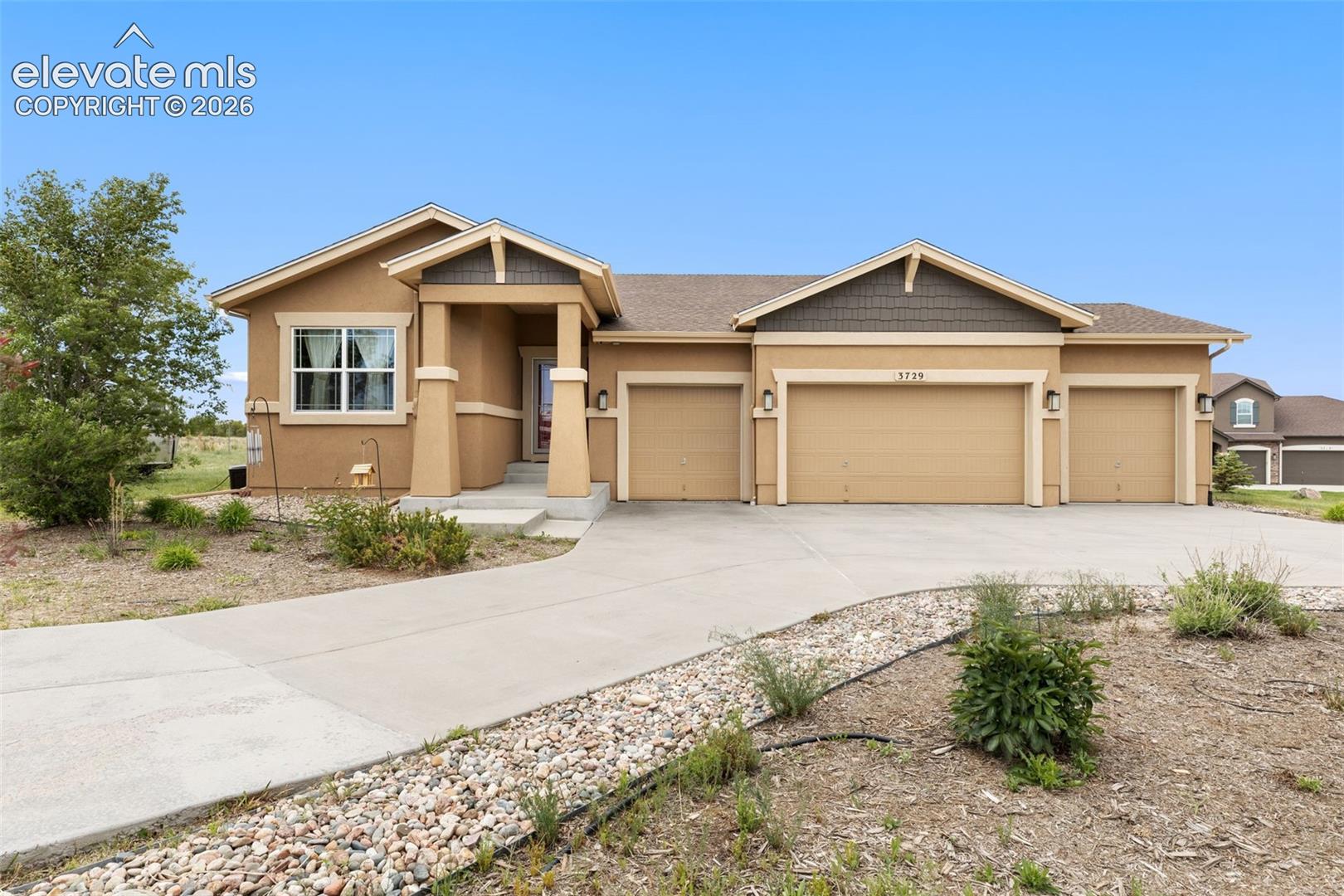 Front of house with 4 car garage