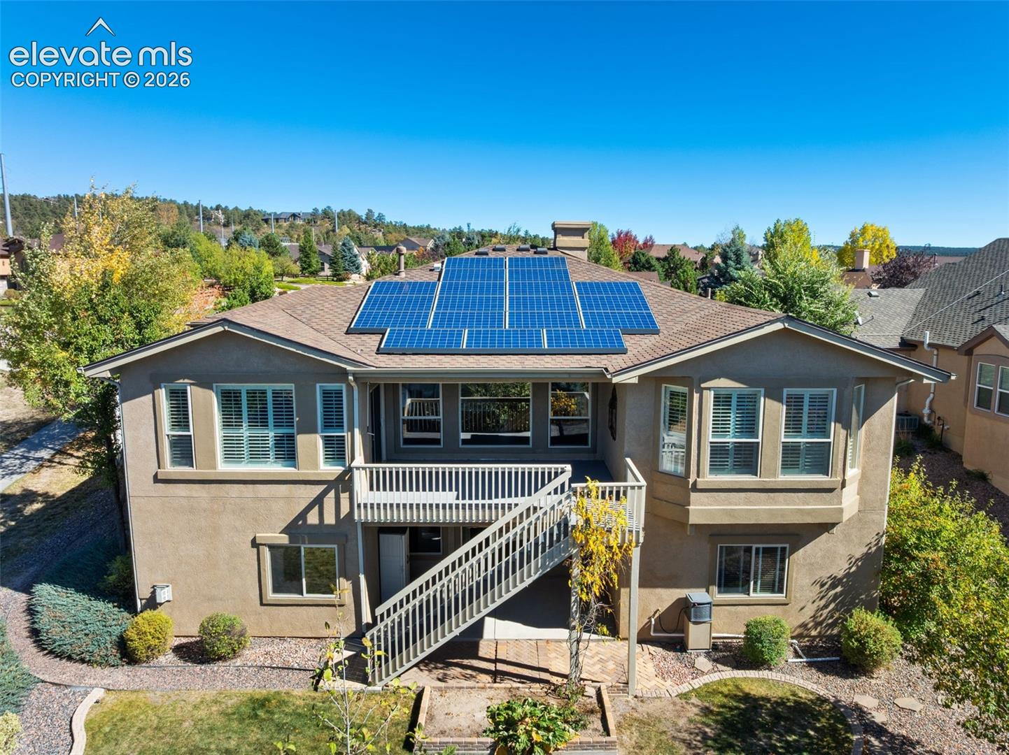 BACK OF HOME WITH SOLAR 