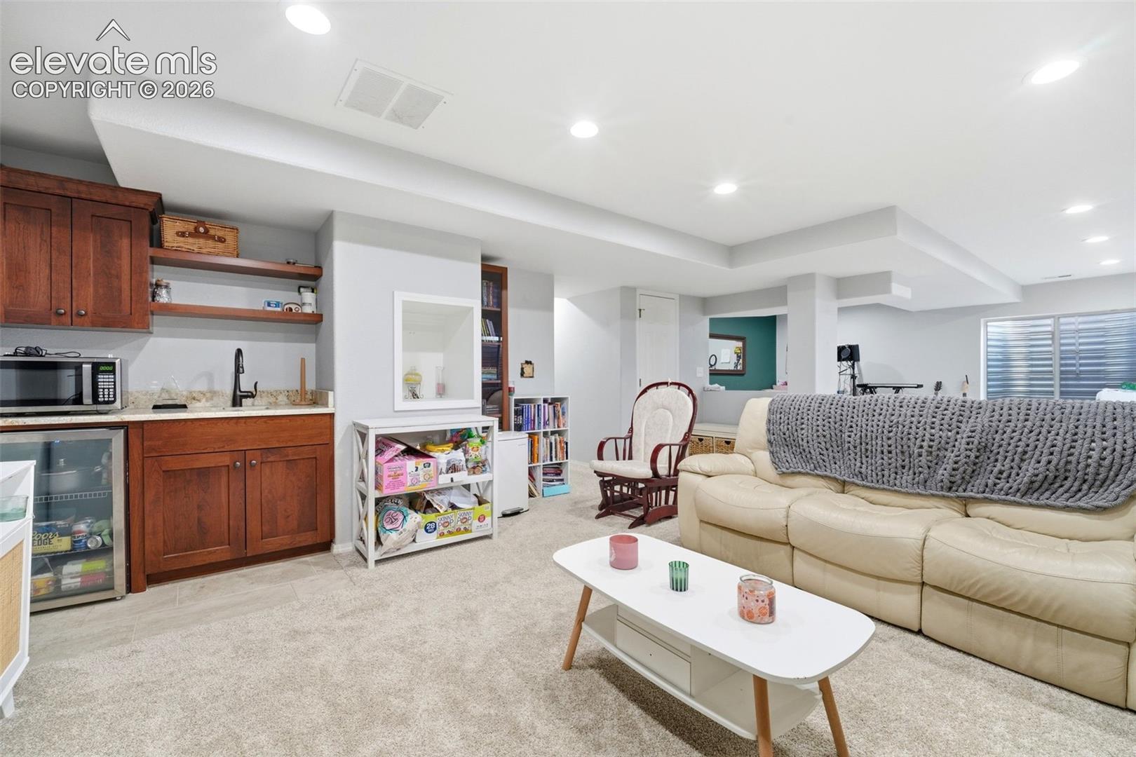Finished lower level featuring recessed lighting and plush carpet flooring