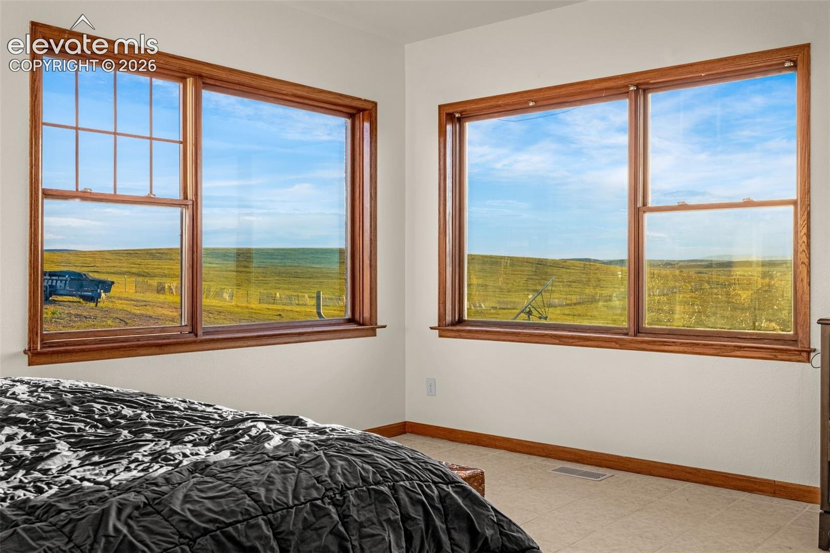 Dual windows with wood-finish trim and sills