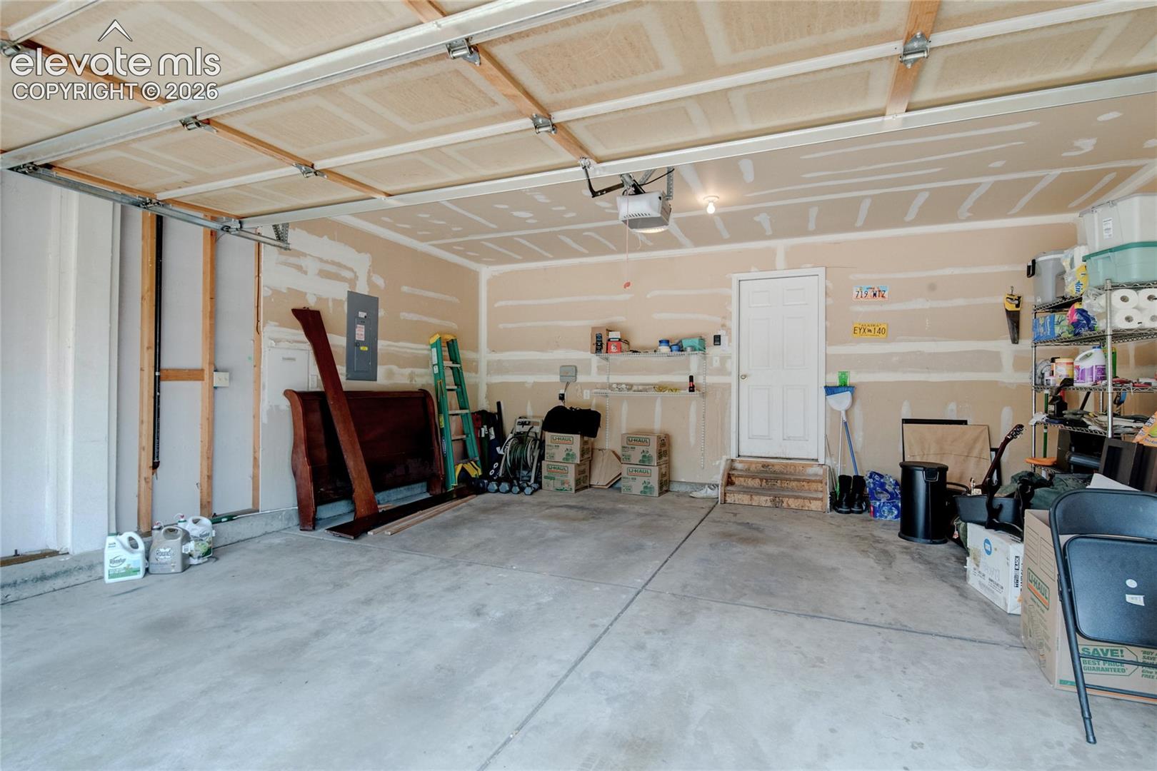 Concrete flooring garage with an overhead automatic door system