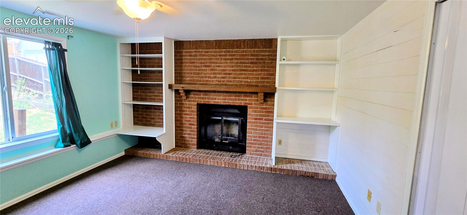 Garage level bedroom with fireplace
