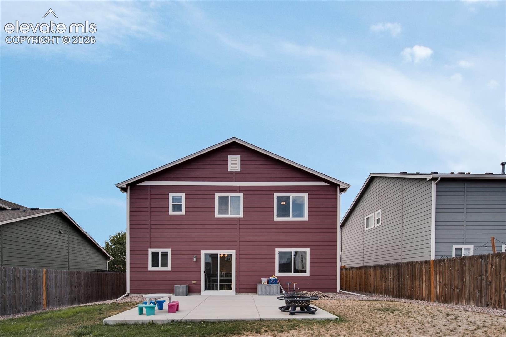 Low maintenance fenced backyard with lots of space for outdoor fun.