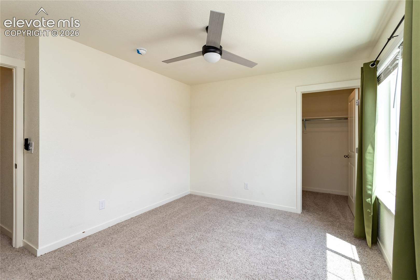 Bedroom 3 with a walk-in closet