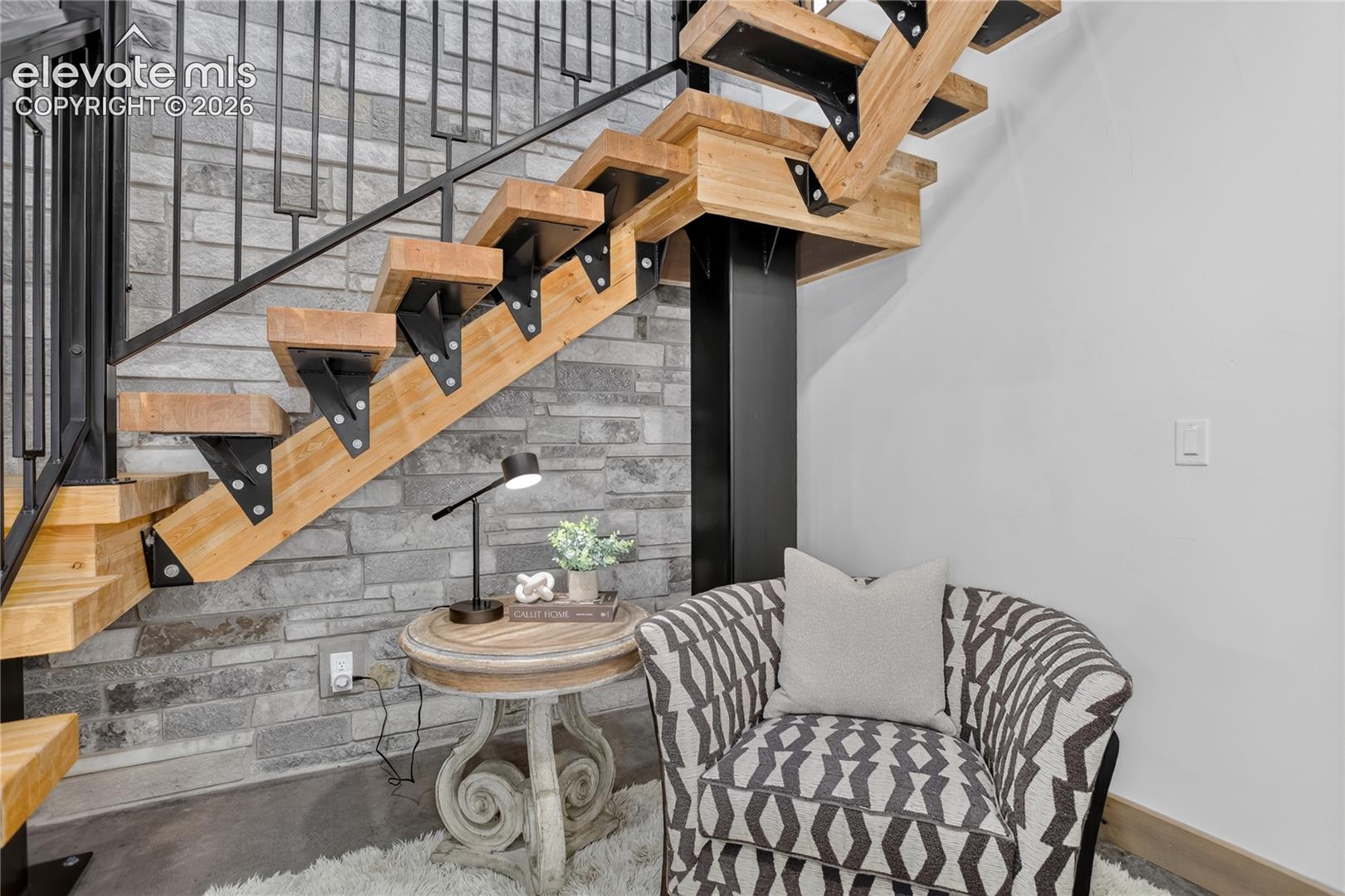 Reading nook under floating staircase