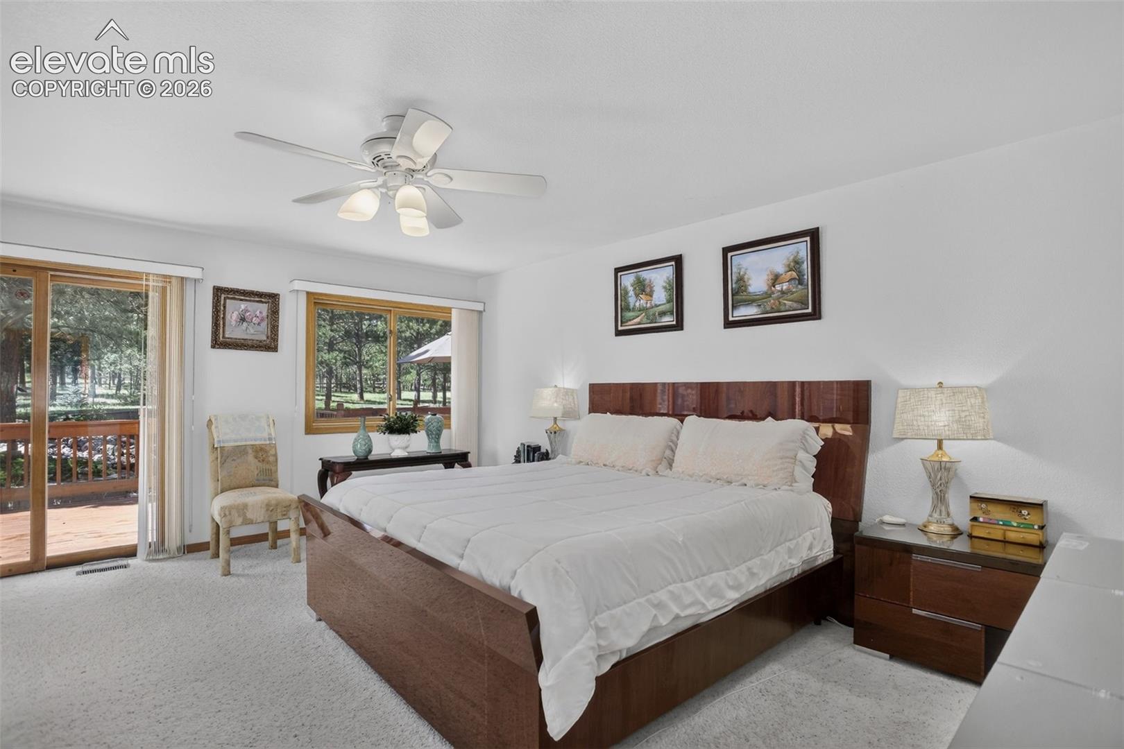 Primary bedroom with walk out to back deck and en suite bathroom.