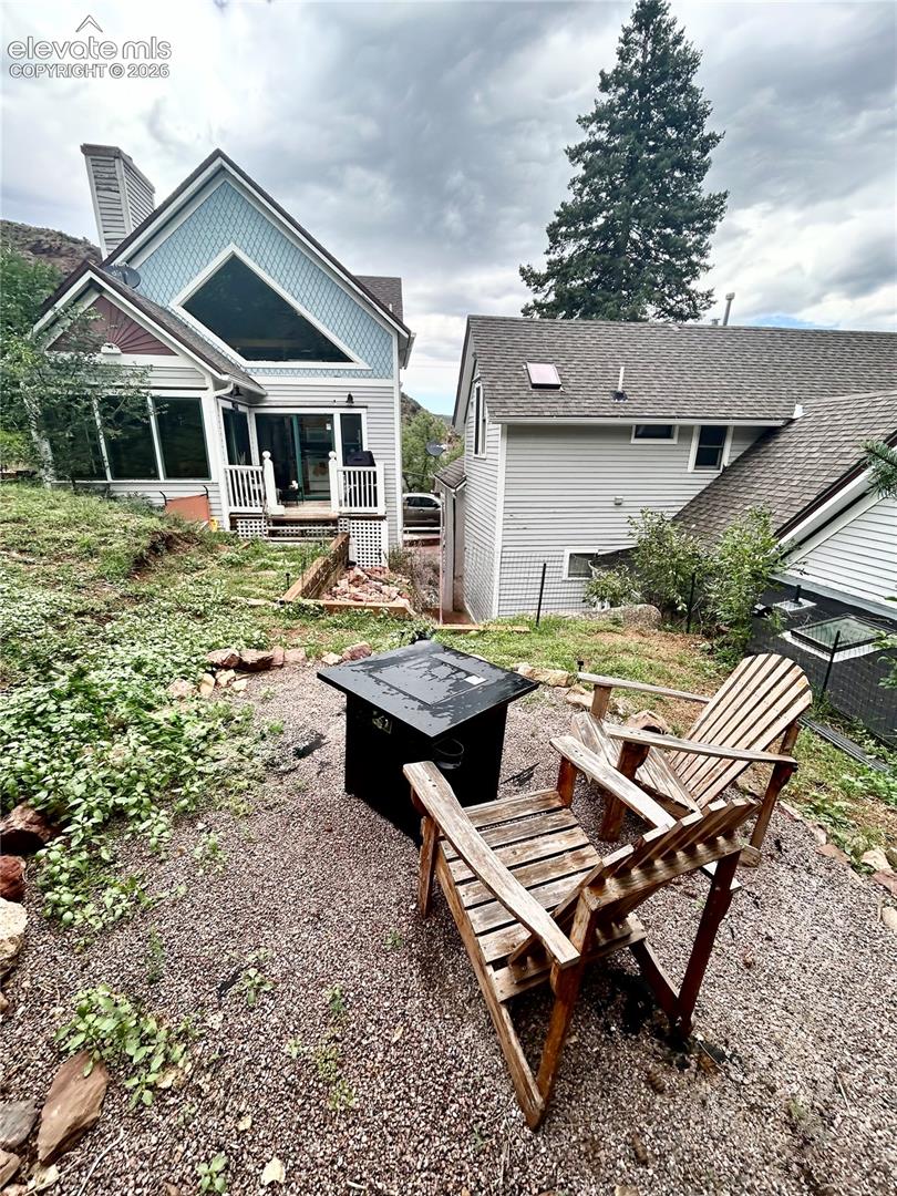 Rear view of the 3 Hydro Custom cottage on the left and the Main Victorian on the right with the tiled walk way between the homes. There is a new patio and walkway in the rear not reflected in this picture.
