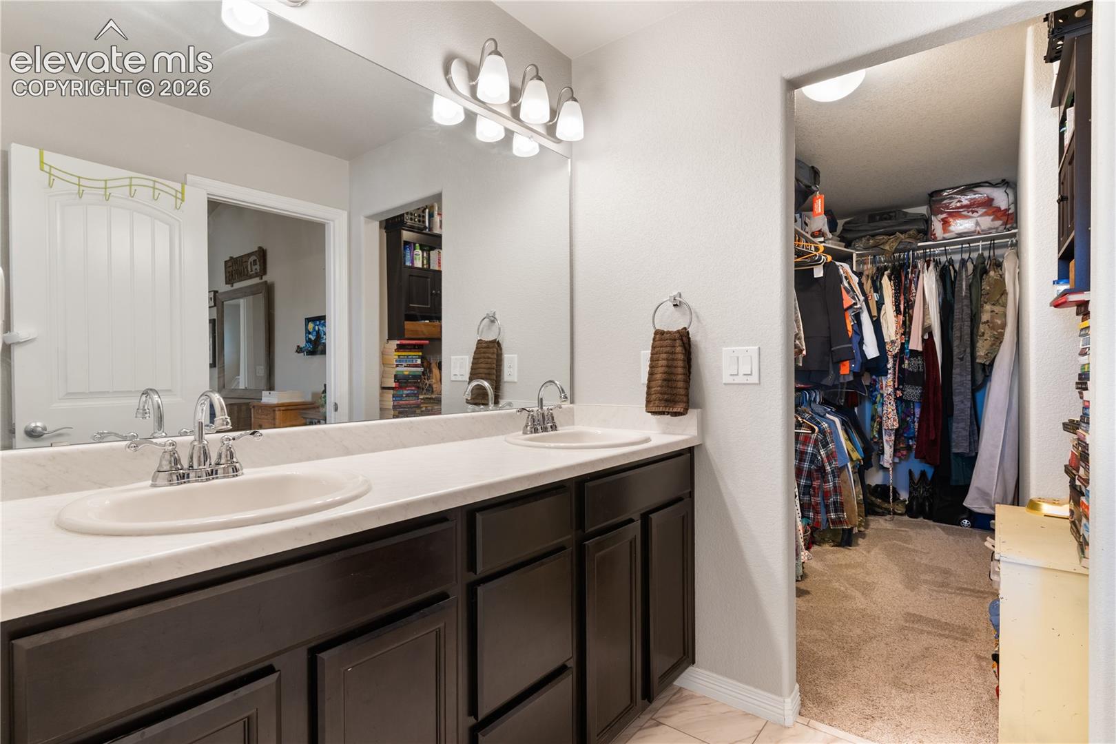 Spacious walk in closet with upgraded closet system