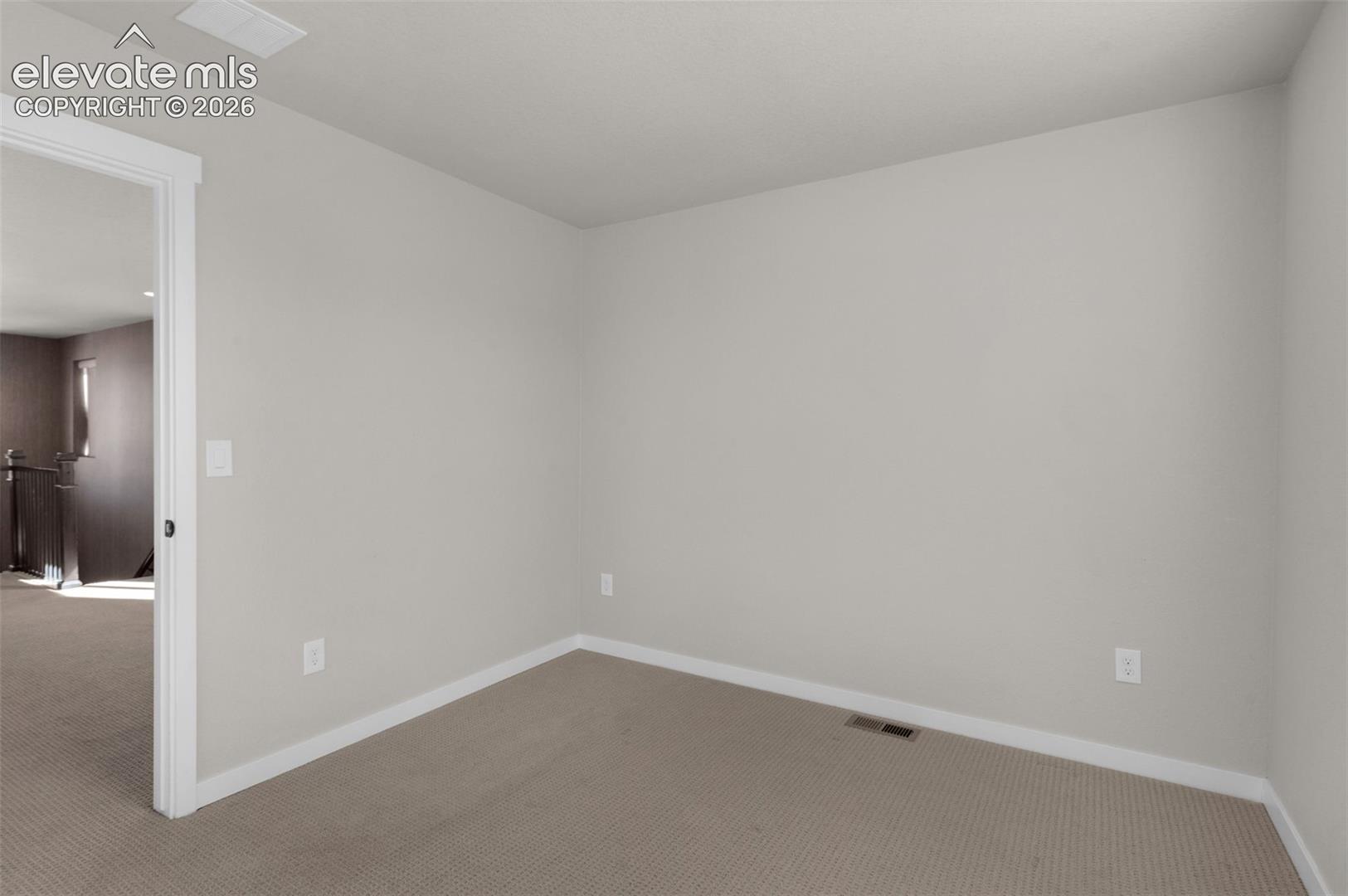 Neutral paint palette, carpet flooring, and white trim