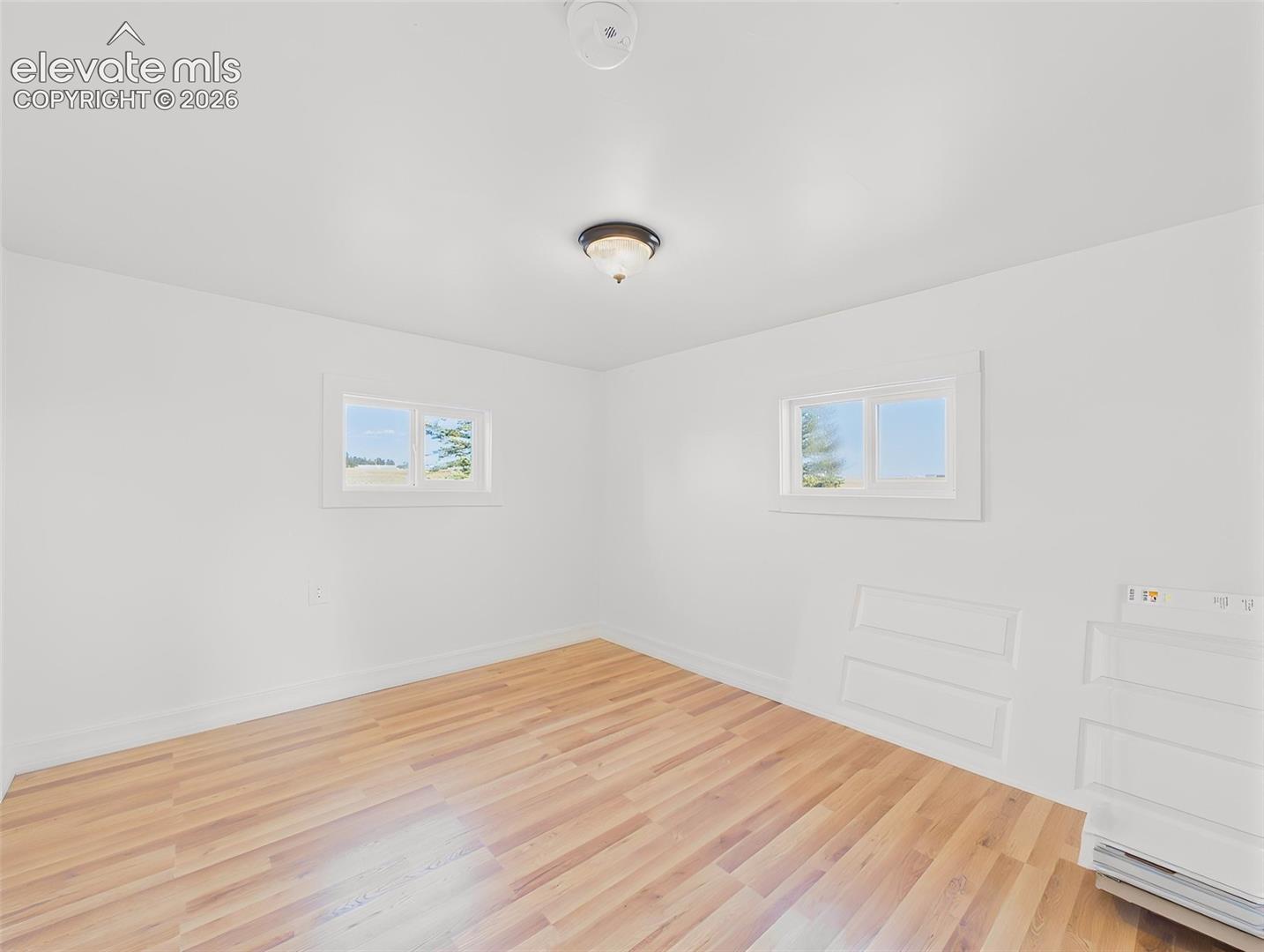 Secondary Bedroom – Spacious secondary bedroom offers a large closet, new flooring, and abundant natural light.