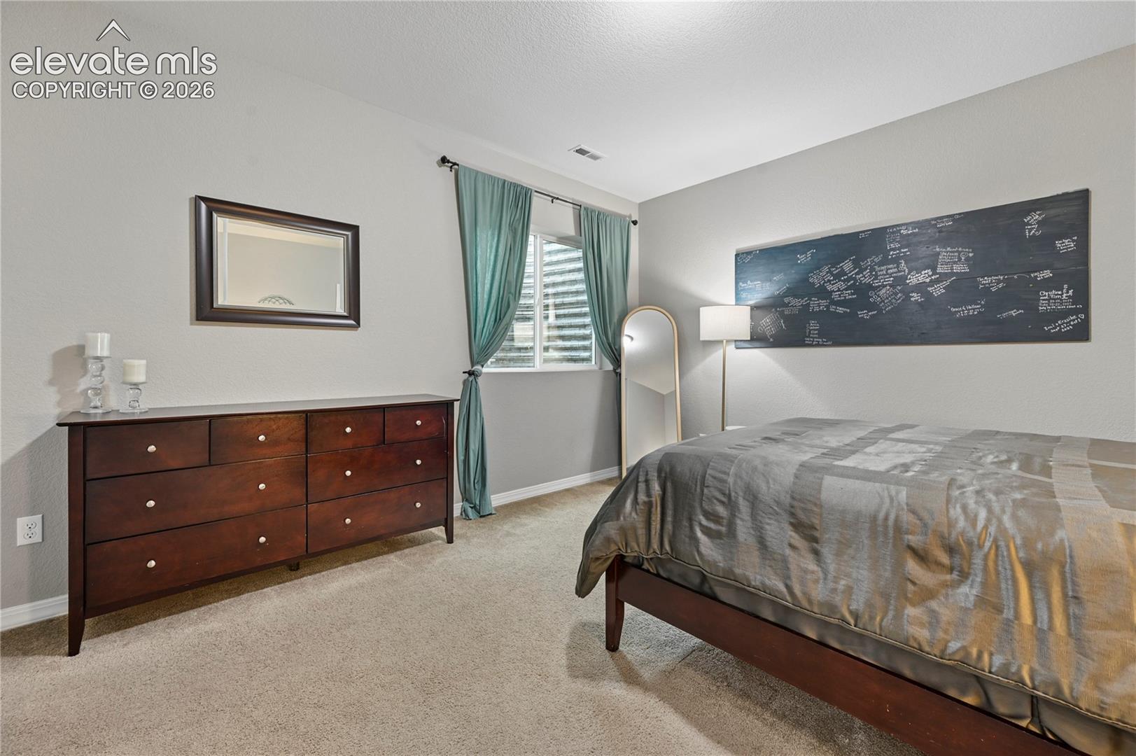 Bedroom #4 of 5 is in the basement and around the corner from a full bathroom.  It's big enough for a queen-sized bed, which could make it a guest room.