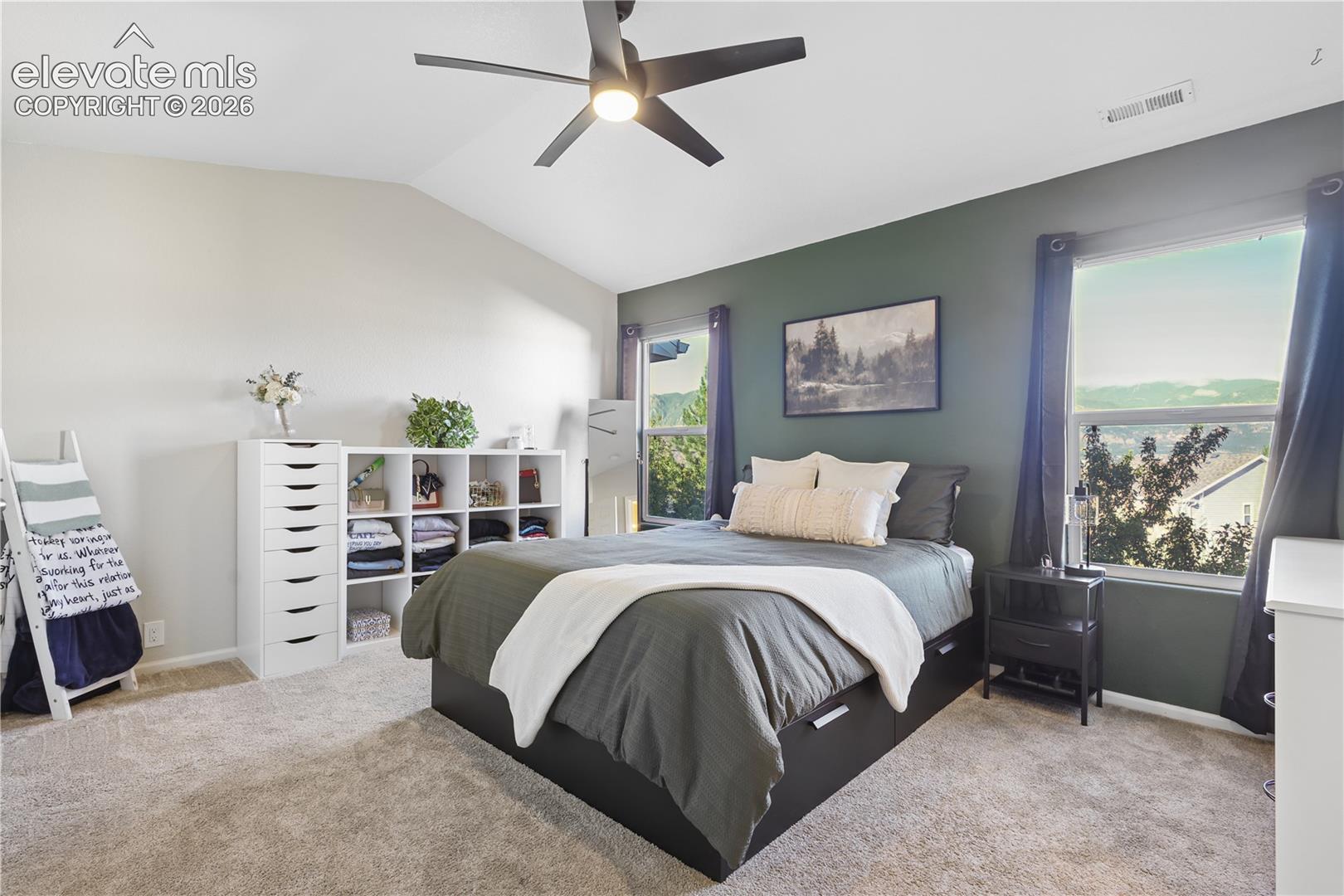 Large master bedroom with two closets and mountain views