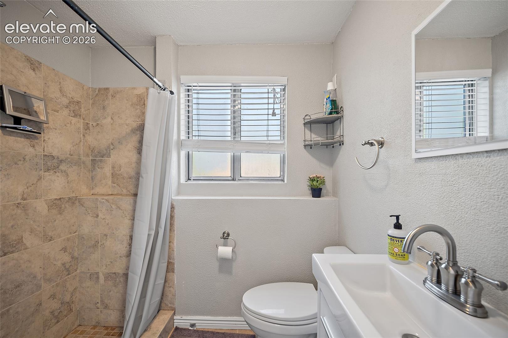 Updated bathroom with tile shower.