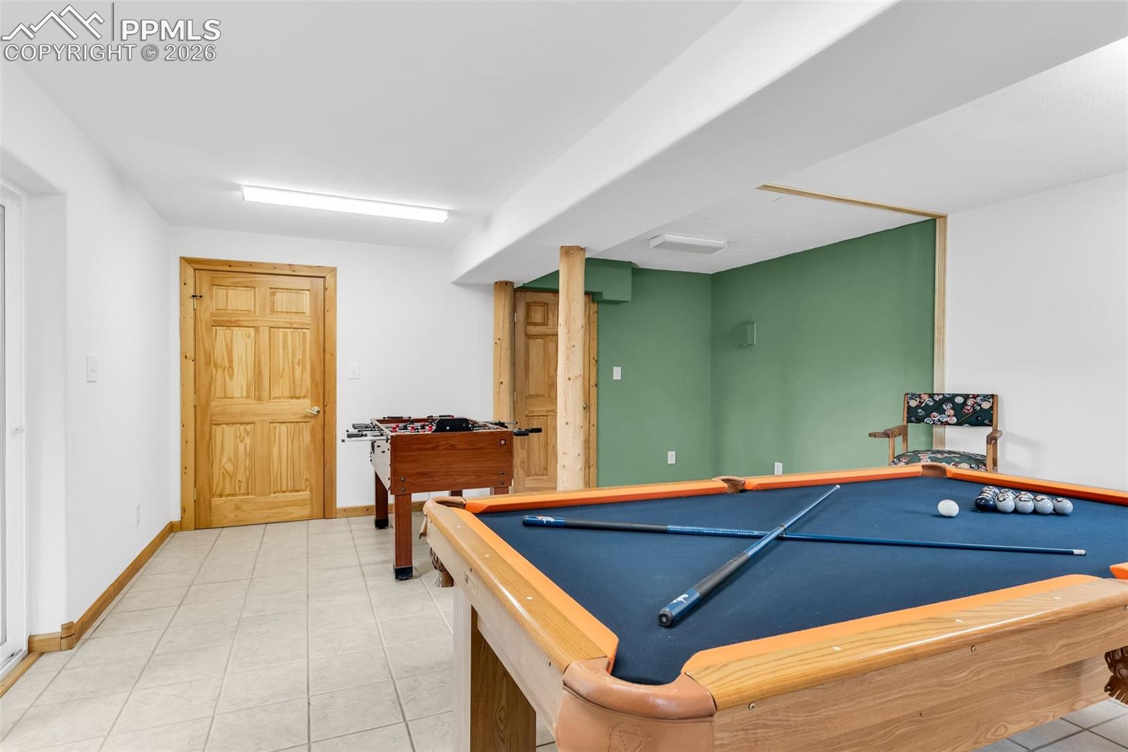 Great space for a bar or kitchenette in the current gameroom. Would also make a great workshop with easy access to outside!