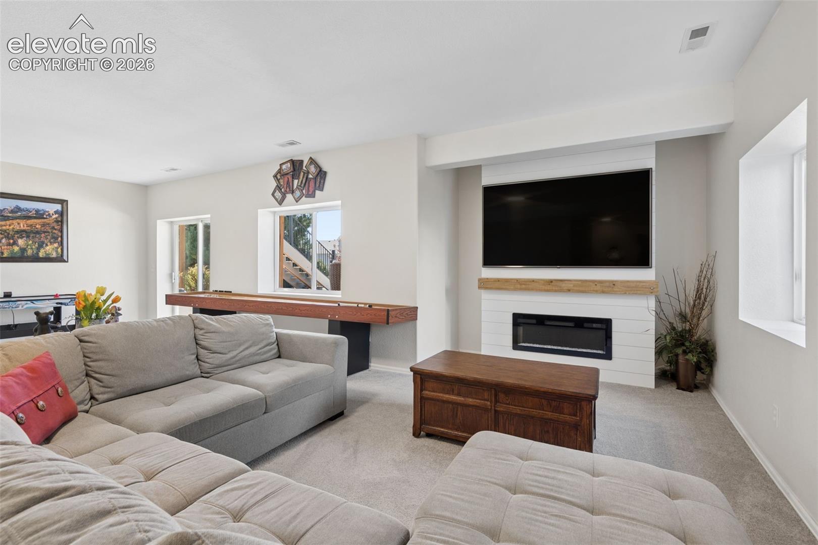 Carpeted living area featuring, 